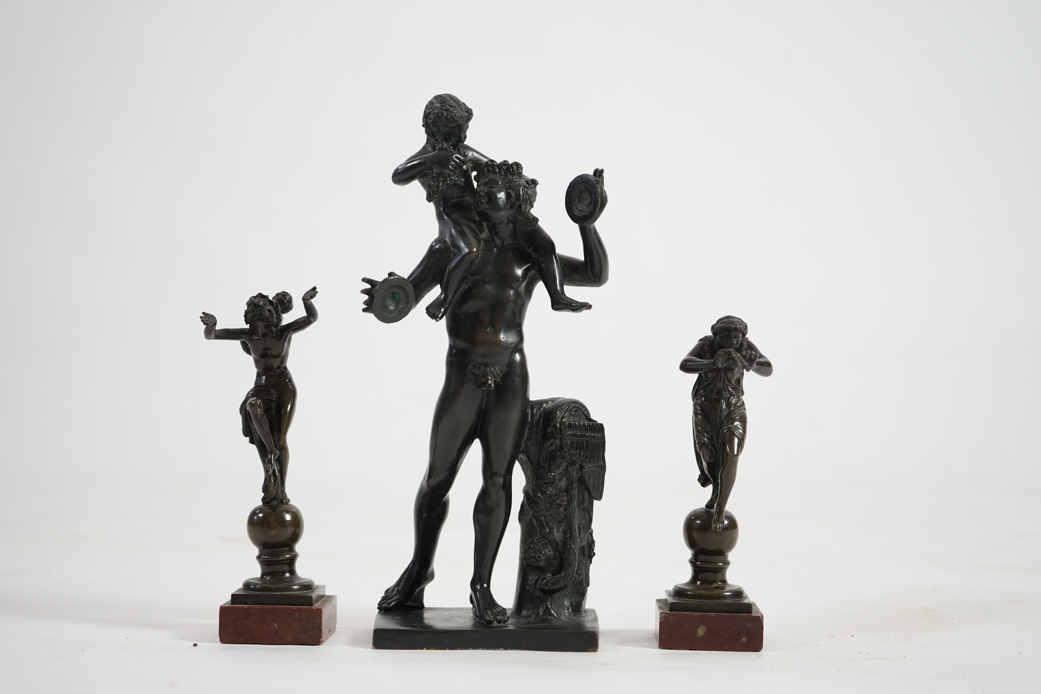 After the antique, three classical bronzes, faun with child Dionysius